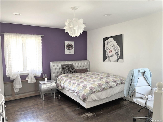 bedroom featuring dark hardwood / wood-style flooring