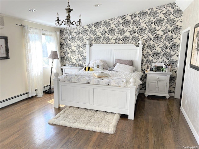 bedroom with dark hardwood / wood-style floors and a notable chandelier