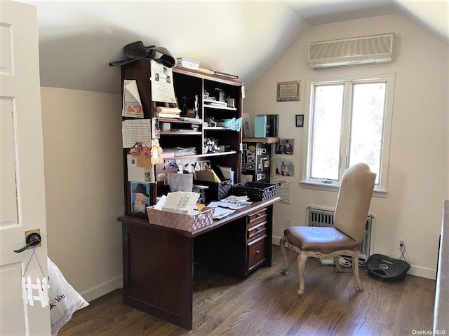 home office featuring dark hardwood / wood-style floors, vaulted ceiling, radiator, and a wall unit AC