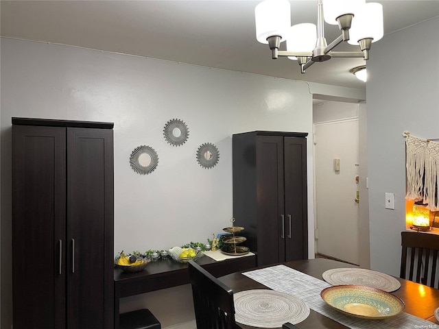 dining space with an inviting chandelier