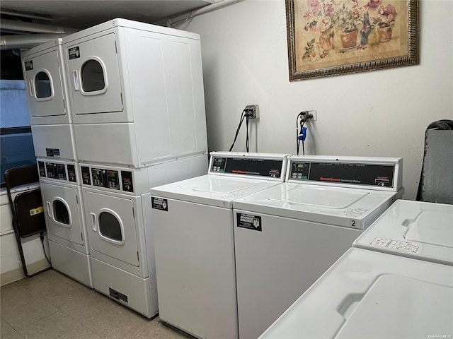 laundry area featuring stacked washer / dryer and washer and dryer