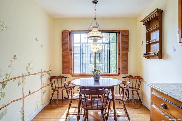 dining area featuring light wood-type flooring