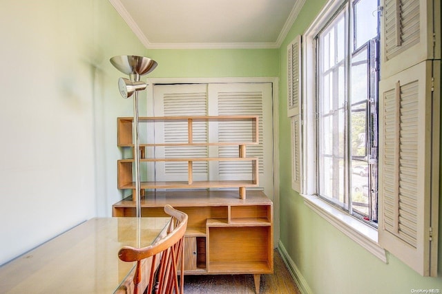 interior space with crown molding, hardwood / wood-style floors, and a healthy amount of sunlight