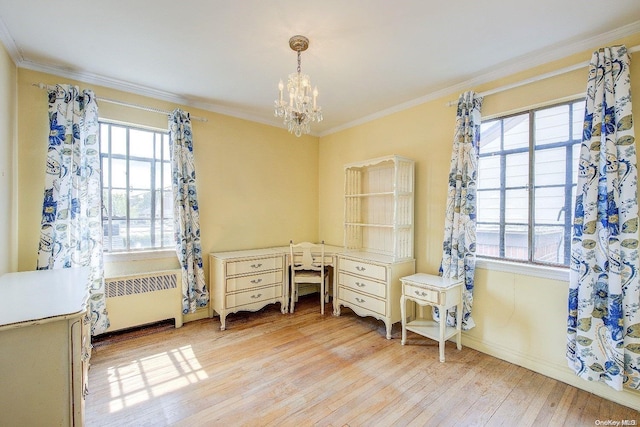 office area with radiator heating unit, an inviting chandelier, light hardwood / wood-style flooring, and ornamental molding