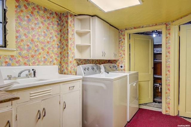 clothes washing area with cabinets, independent washer and dryer, light carpet, and sink