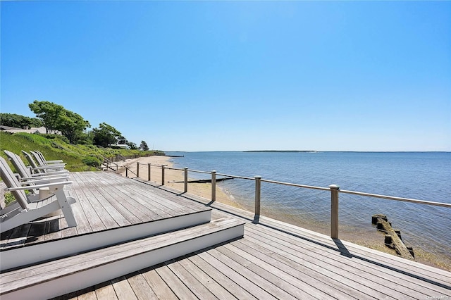 wooden deck with a water view