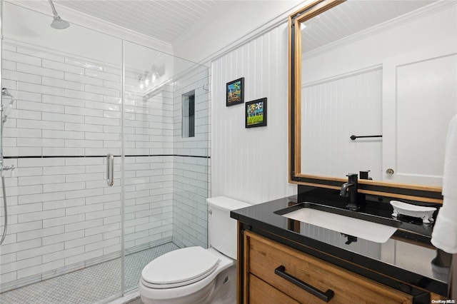 bathroom with an enclosed shower, vanity, toilet, and crown molding