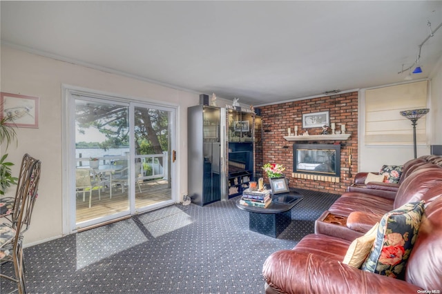 living room featuring crown molding and a brick fireplace