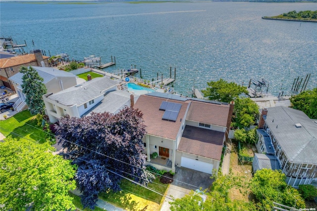 birds eye view of property with a water view