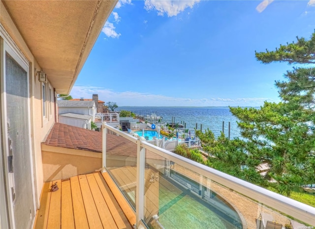 balcony featuring a water view