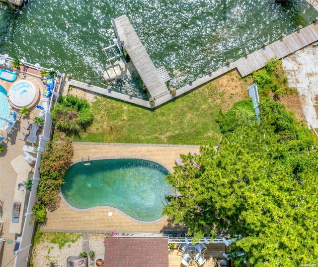 view of swimming pool featuring a water view