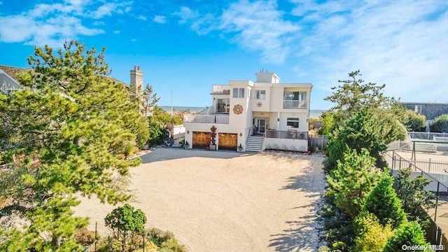 view of front of home with a balcony