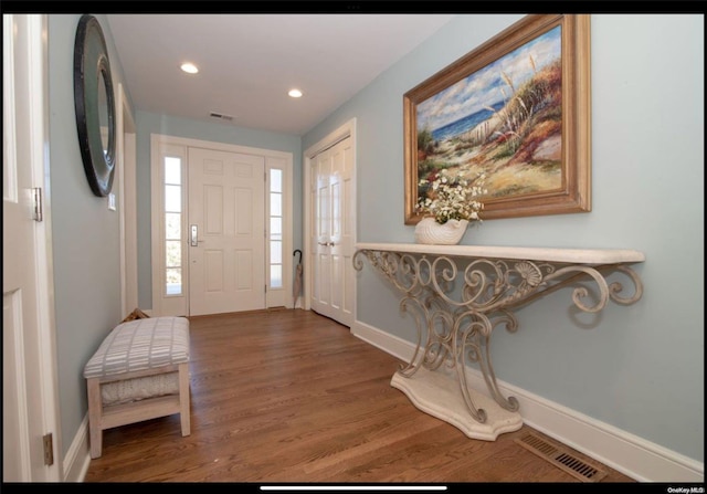 entrance foyer with hardwood / wood-style floors