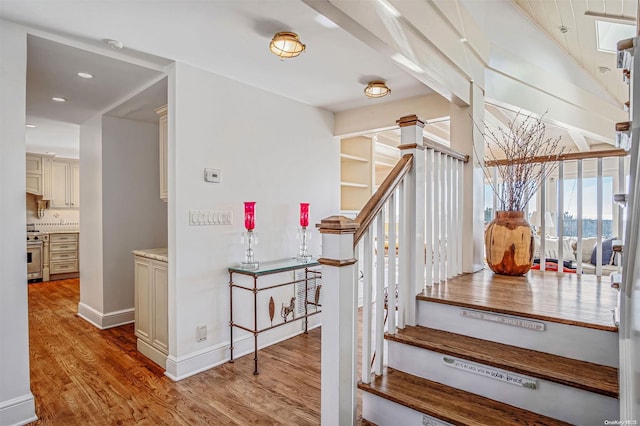 stairs with hardwood / wood-style floors