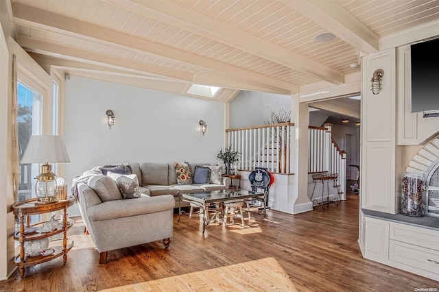 living room featuring hardwood / wood-style flooring, vaulted ceiling with beams, and wood ceiling