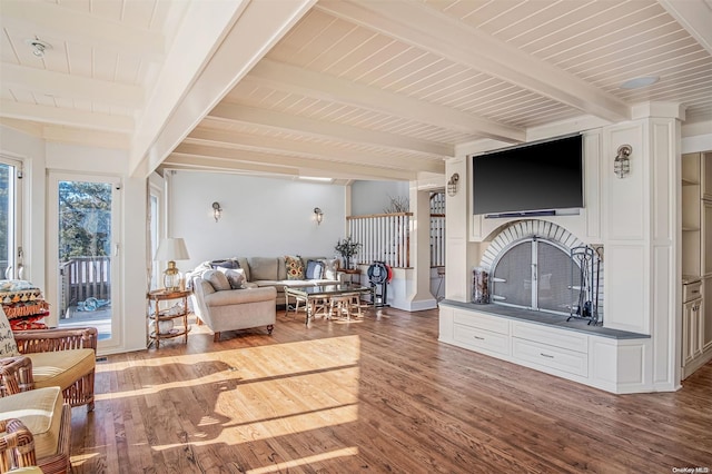 living room featuring beam ceiling, wood ceiling, and wood-type flooring