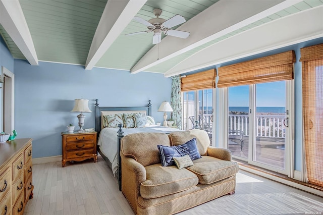 bedroom with access to exterior, ceiling fan, lofted ceiling with beams, a water view, and light hardwood / wood-style floors