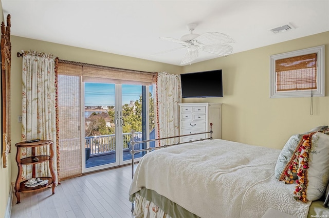 bedroom featuring access to exterior, ceiling fan, and hardwood / wood-style floors