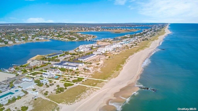 bird's eye view with a water view and a view of the beach