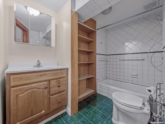 bathroom with tile patterned floors, vanity, and toilet