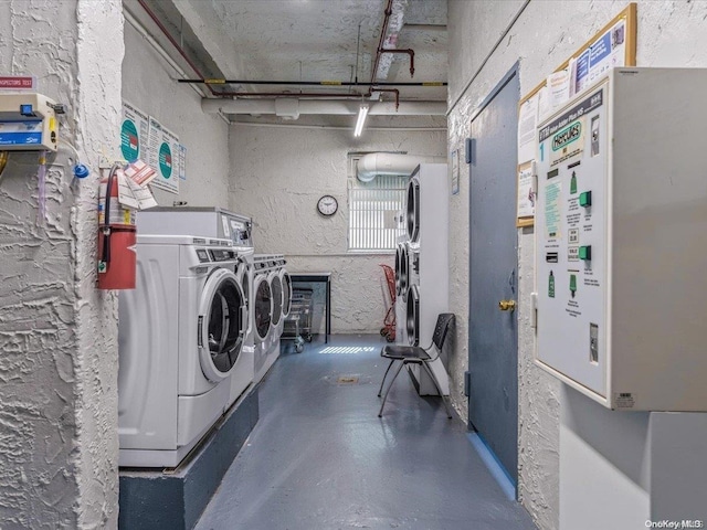 clothes washing area with washer and dryer