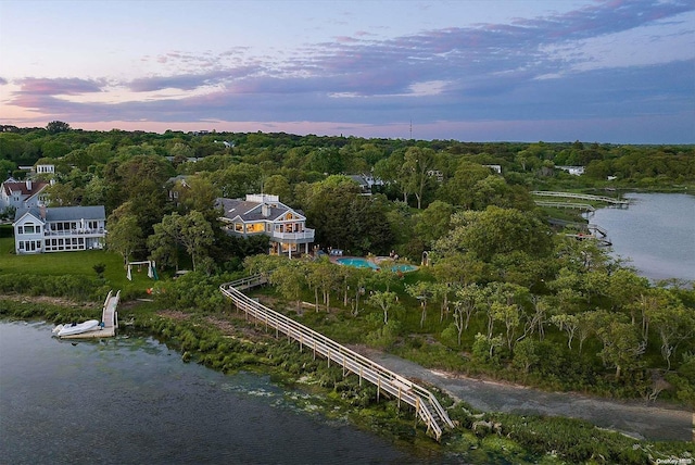 aerial view at dusk with a water view