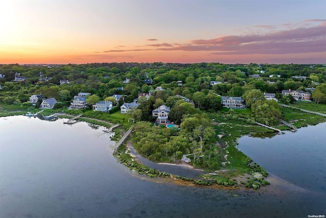 aerial view at dusk with a water view