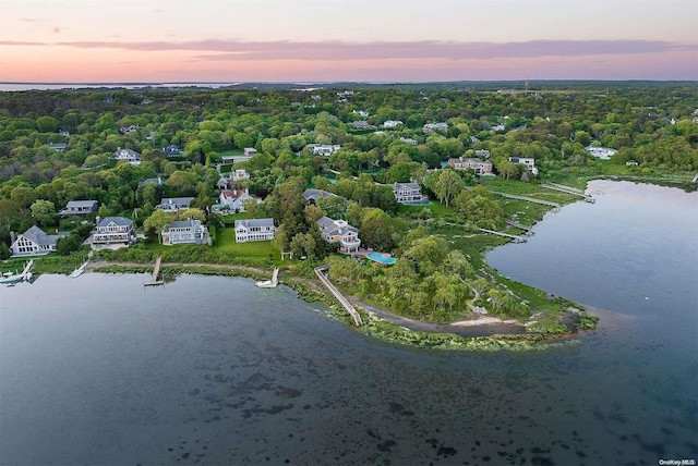 aerial view at dusk with a water view