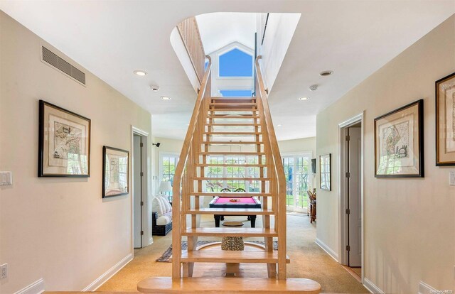 134 Middle Pond Rd, Southampton, NY 11968 - stairway featuring carpet floors, recessed lighting, and arched walkways