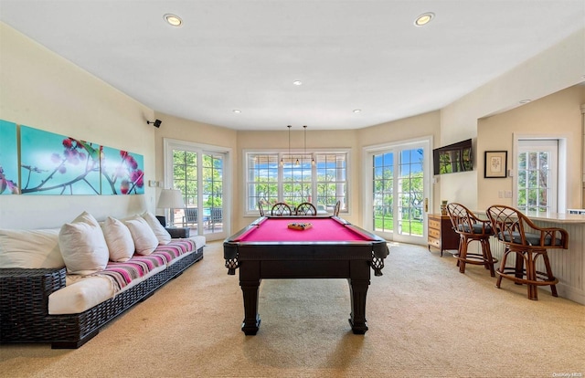 recreation room with light colored carpet and billiards