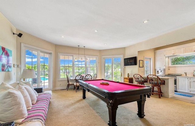 recreation room featuring light colored carpet and billiards