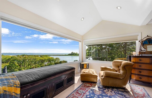 134 Middle Pond Rd, Southampton, NY 11968 - sitting room featuring a water view, vaulted ceiling, recessed lighting, and wood finished floors