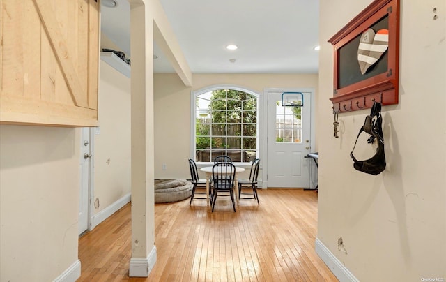 doorway to outside with light hardwood / wood-style floors