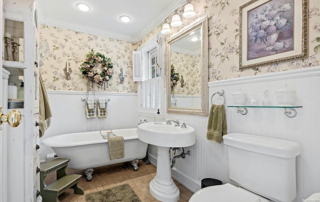 bathroom featuring toilet, tile patterned flooring, a bath, and ornamental molding