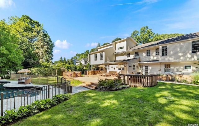 view of yard with a swimming pool side deck and an outdoor living space