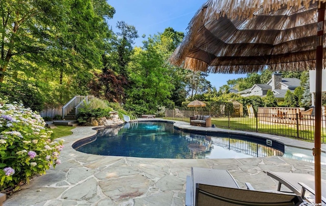 view of swimming pool with a patio area