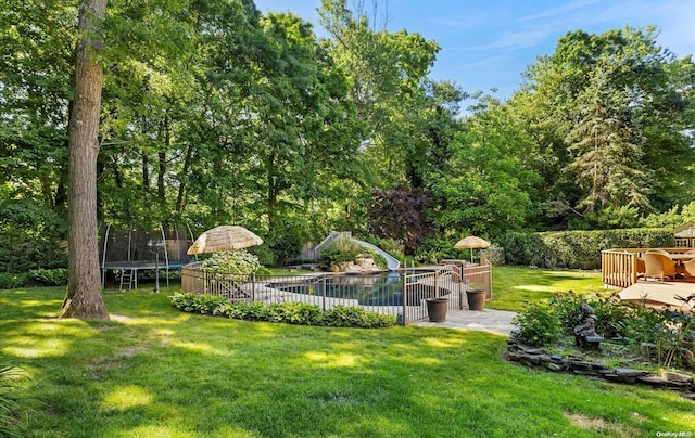 view of yard featuring a trampoline