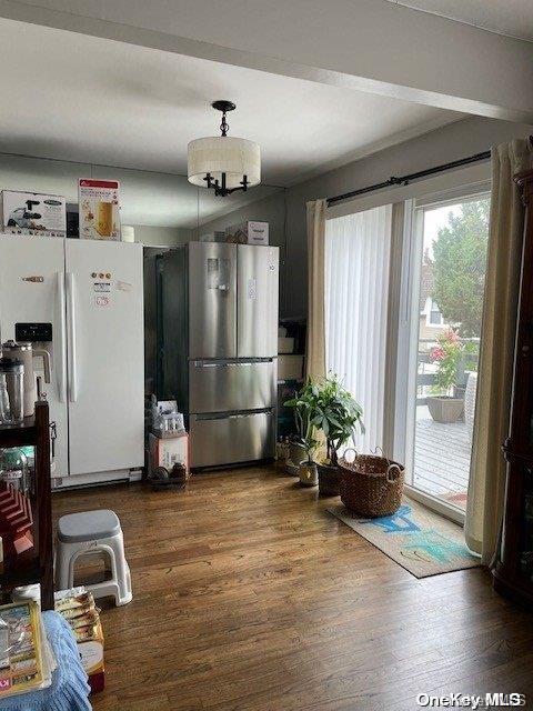 dining space featuring dark wood-type flooring