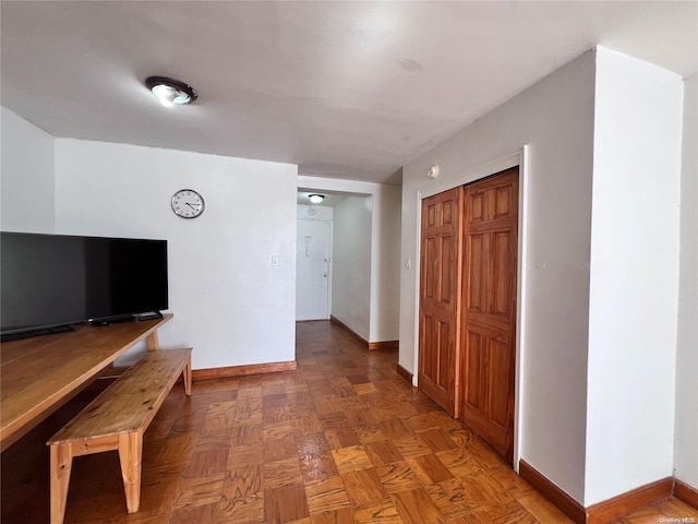 hallway featuring dark parquet floors