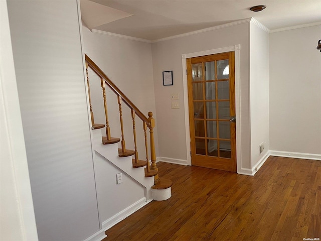 stairs featuring hardwood / wood-style flooring and ornamental molding