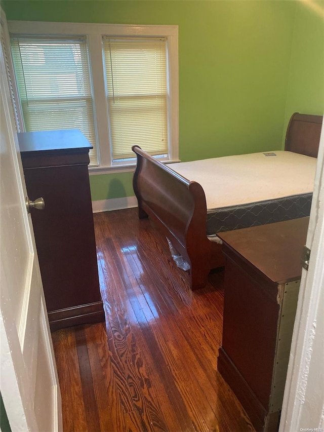 bedroom featuring dark hardwood / wood-style floors