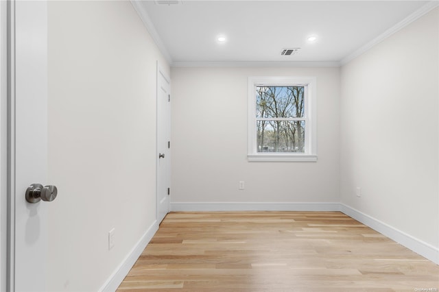 unfurnished room with light hardwood / wood-style floors and ornamental molding