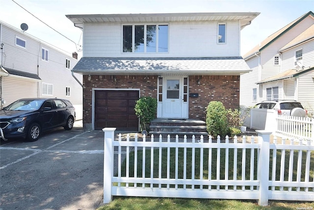 front of property with a garage