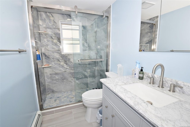 bathroom featuring vanity, toilet, and a shower with door