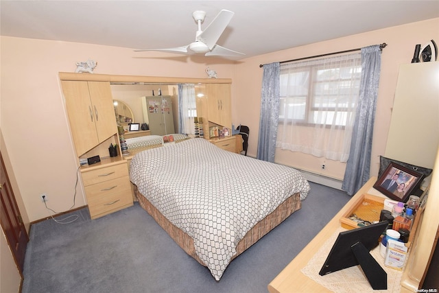 carpeted bedroom with ceiling fan and a baseboard radiator