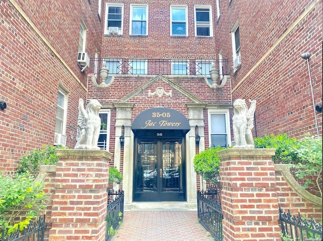 view of exterior entry featuring french doors