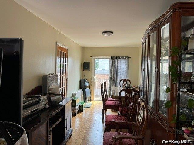 dining room with light wood-type flooring and french doors