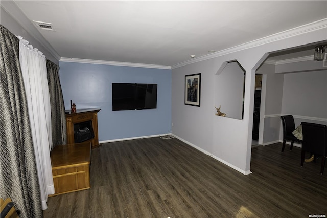 living room featuring dark wood-type flooring and ornamental molding