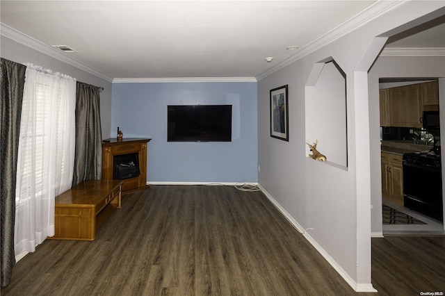 unfurnished living room with crown molding and dark wood-type flooring