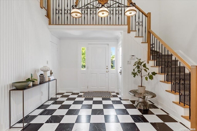 entryway with a towering ceiling